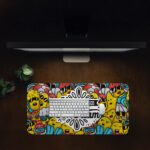 Colorful doodle-style desk pad with cartoon characters and “Stay Focused On Your Dream” quote in black text on a white cloud-like shape.