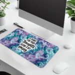 Infidu Ocean Desk Pad with seahorses, swirling ocean patterns, and bold quote on a colorful purple and teal background.