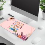 Pastel pink desk pad with floral corners, playful “Enjoy the Sunny Summer” text, sunglasses, sun rays, and vintage art style accents.