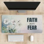 Watercolor desk pad with white flowers, pastel background, and bold “FAITH over FEAR” quote in vintage art style.