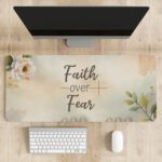 Pastel floral desk pad with “Faith over Fear” script, white rose, green leaves, and watercolor background in vintage art style.