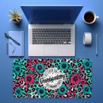 Infidu bold desk pad with bumblebee quote, pink and turquoise leopard print, and floral accents in a fun vintage art style.