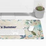 Infidu Summer Desk Pad with pastel watercolor background, green and blue leafy branches, and handwritten summer quote.