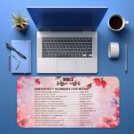 Infidu floral desk pad with soft pink and lavender blooms, featuring Bible emergency numbers for women on a light pink gradient background
