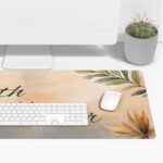 Pastel desk pad with “Faith over Fear” quote in script font, surrounded by watercolor-style leaves and flowers in soft, earthy tones.