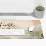 Pastel floral desk pad with “Faith over Fear” script, white rose, green leaves, and watercolor background in vintage art style.